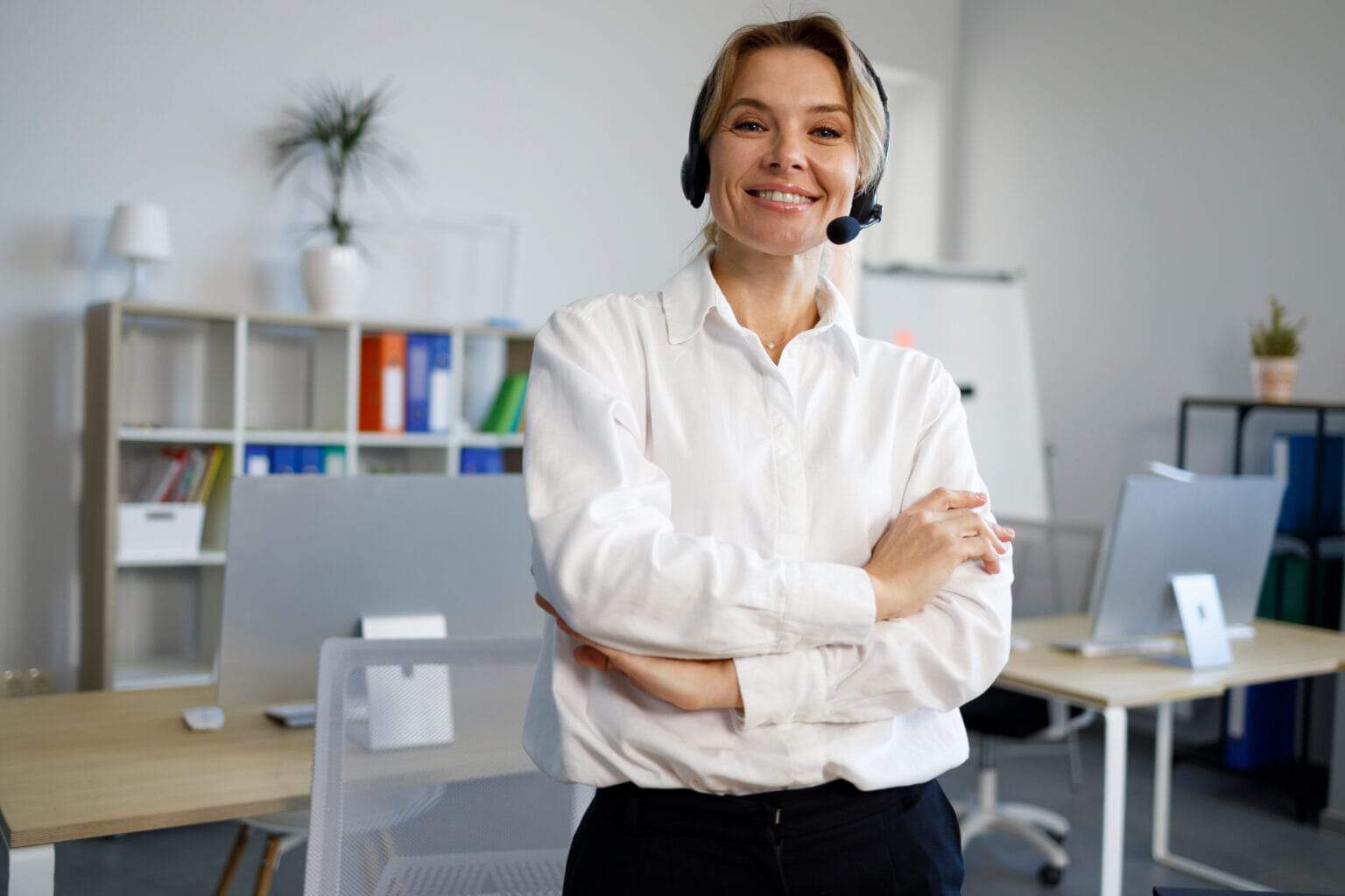 portrait-of-smiling-female-helpline-operator-in-he-2022-06-02-09-51-15-utc-1536×1024
